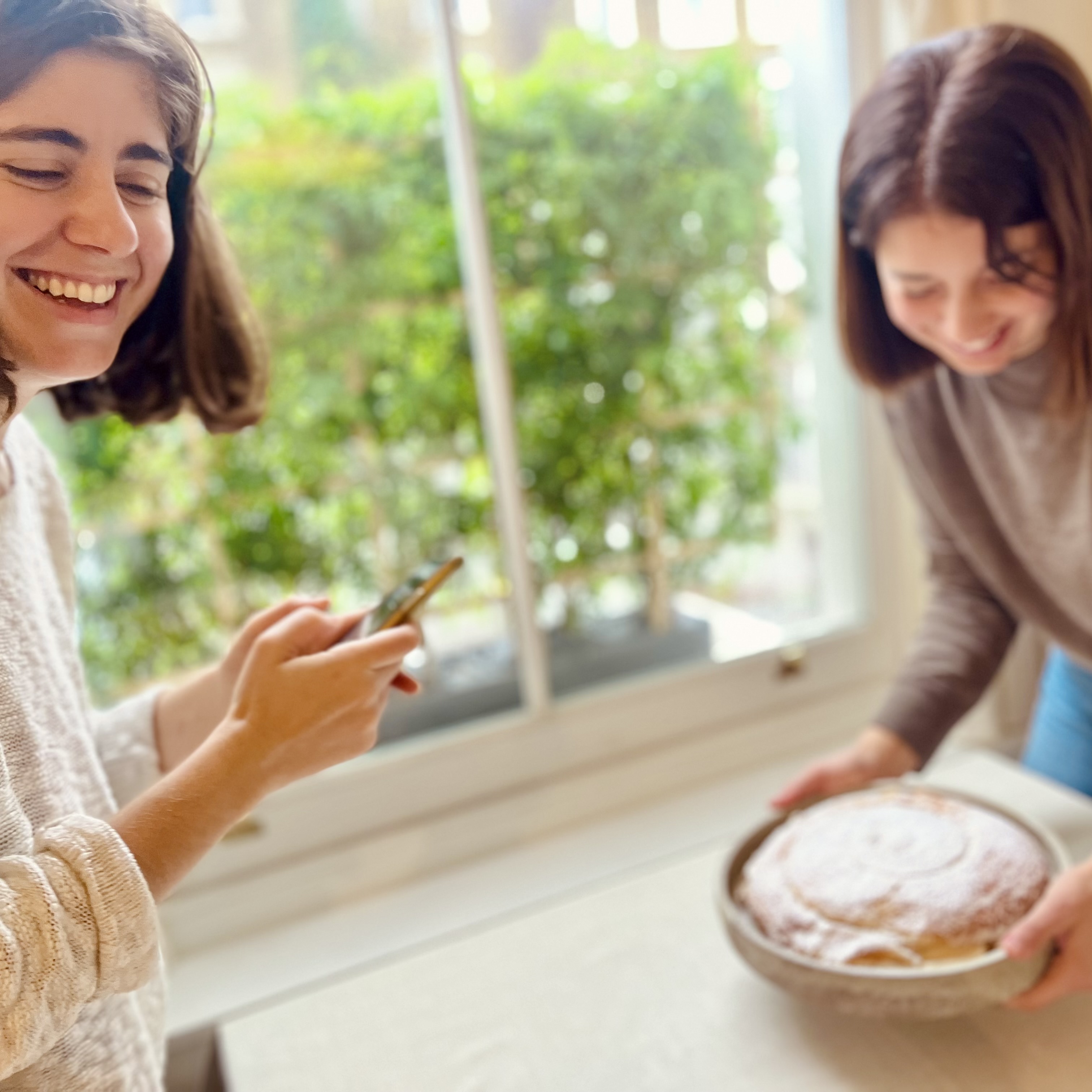 Paloma and Raquel with an ensaimada